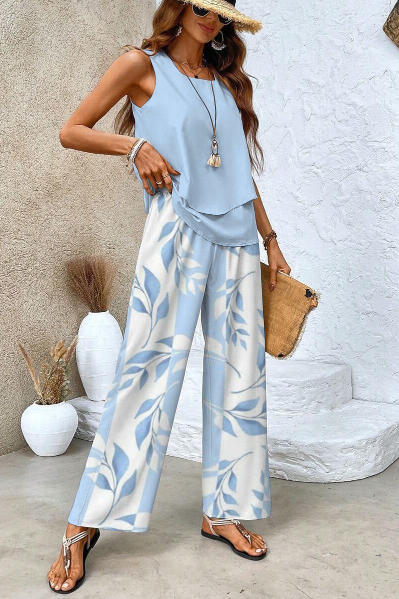 Comfortable & chic women's floral matching set: stylish top & versatile trousers for casual or elegant occasions.