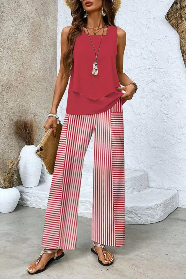 Modern women's elegant floral two-piece set, featuring a stylish top & comfortable trousers for a chic look.