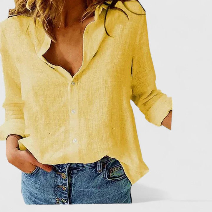 Women's V-neck long sleeve blouse with a delicate floral print, perfect for spring fashion.