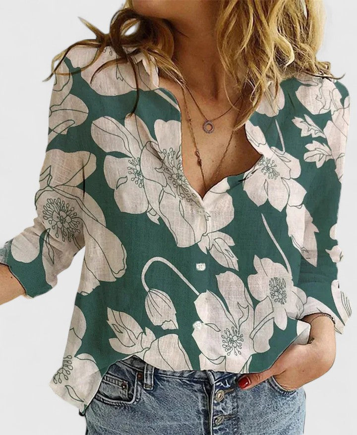 Professional women's floral V-neck blouse with long sleeves, ideal for office workwear.