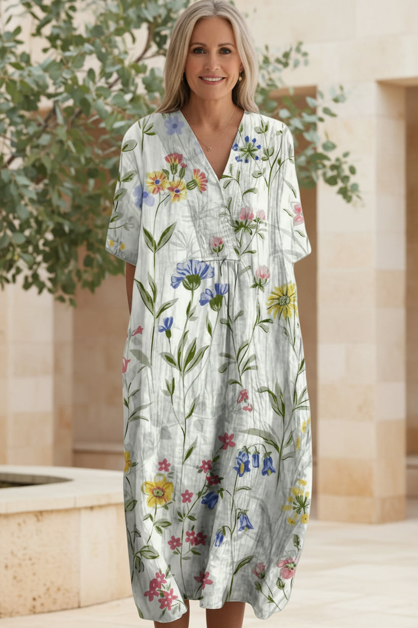 Boho chic floral print summer dress for women, featuring a flattering V-neck and short sleeves.