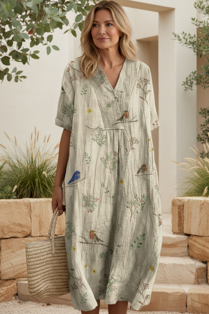 Women's vibrant floral print summer dress, designed with a V-neck and short sleeves for effortless style.