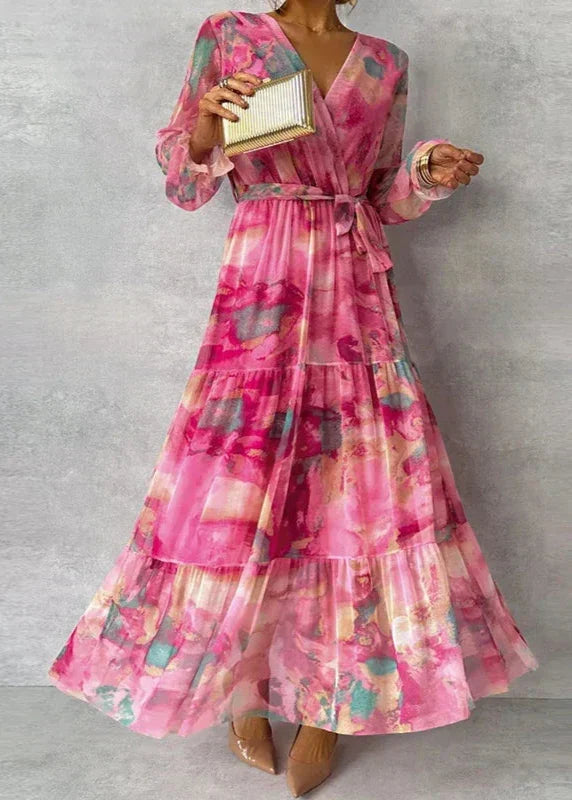 Women's tiered floral print maxi wrap dress with a flattering V-neck and long sleeves, ideal for guests.
