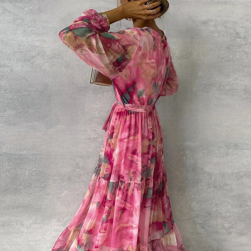Beautiful women's floral V-neck tiered wrap maxi dress, long sleeve, elegant wedding guest outfit.