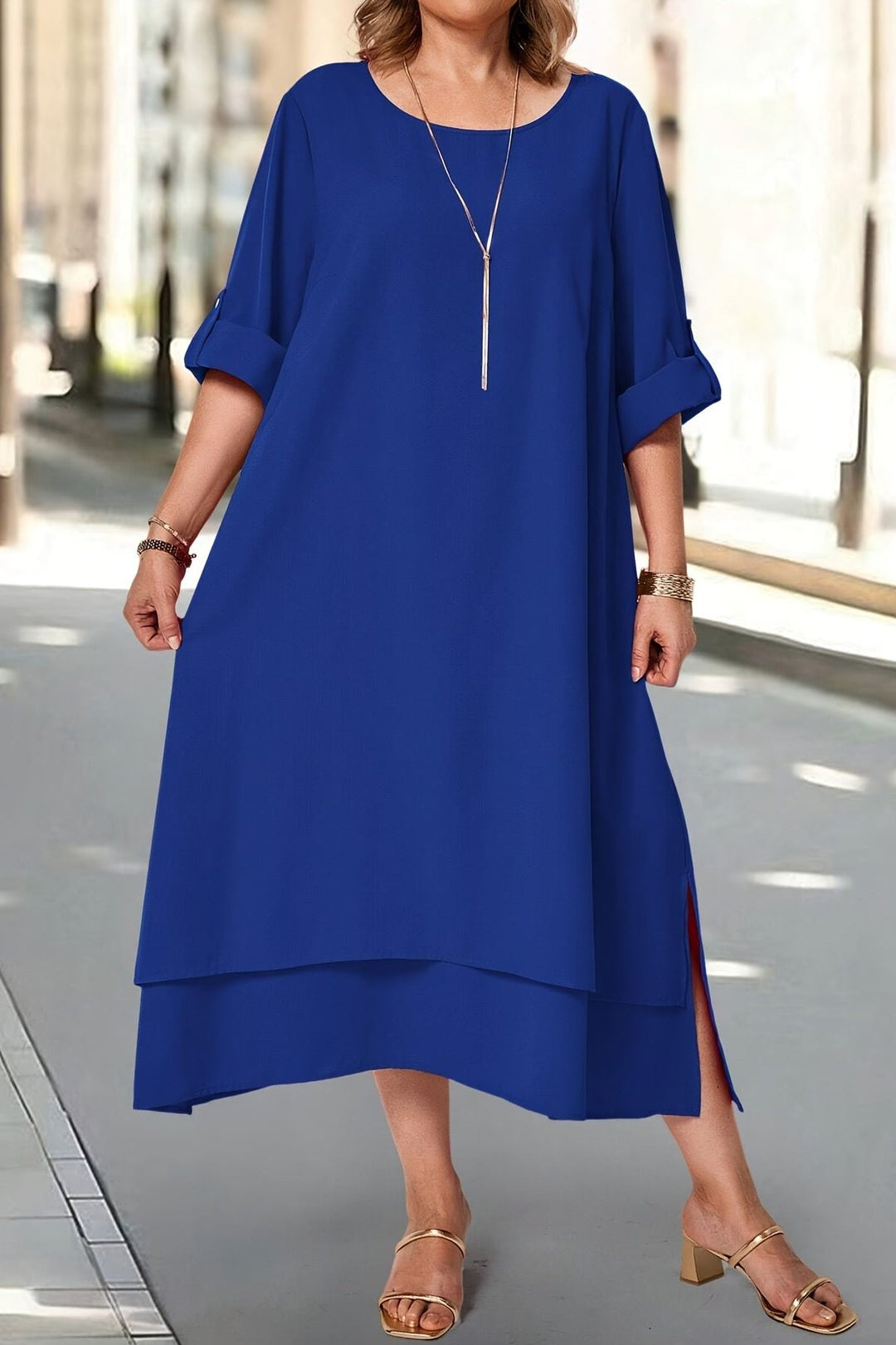 Women's elegant maxi dress with a flattering neckline & flowing skirt, ideal for formal occasions.