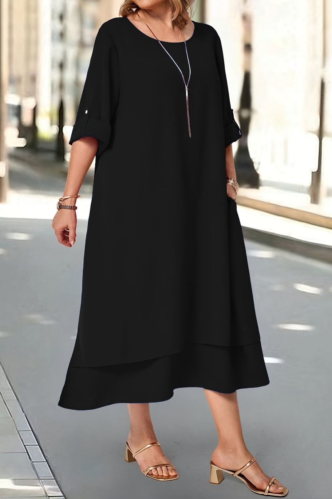 Styling: Women's elegant flowing maxi dress paired with accessories for a sophisticated formal event.