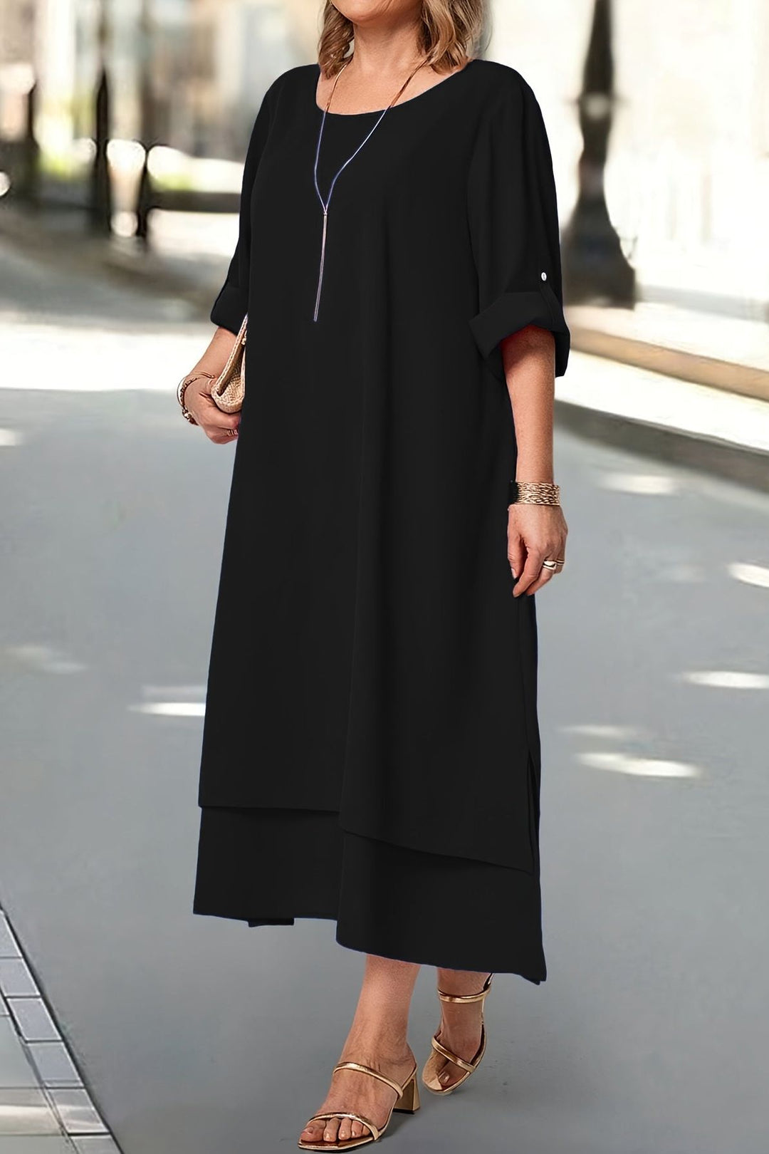 Side profile: Women's elegant flowing maxi dress, highlighting its beautiful drape for formal evening wear.