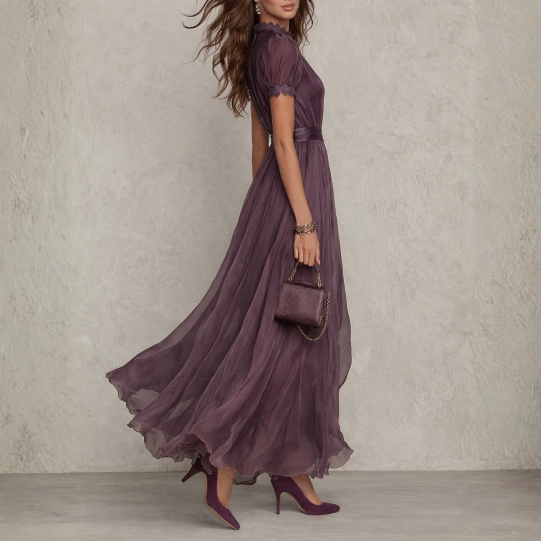 Stunning purple women's maxi dress, flowing silhouette with delicate lace trim, suitable for formal & party wear.