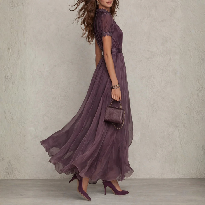 Stunning purple women's maxi dress, flowing silhouette with delicate lace trim, suitable for formal & party wear.