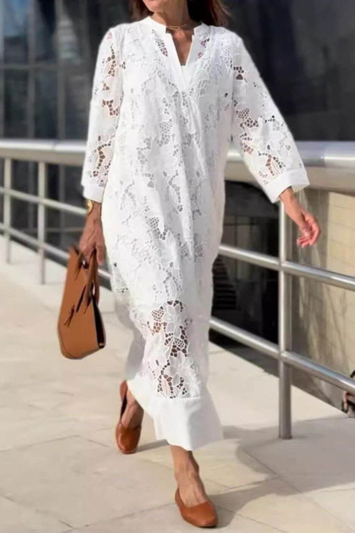Elegant women's flowing white maxi dress for timeless style. Comfortable & relaxed fit, perfect for formal or casual events.