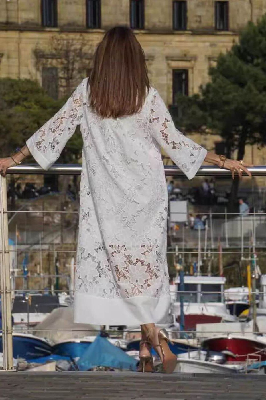 Beautiful women's elegant flowing white maxi dress. Perfect long dress for formal wear or a chic, comfortable event look.