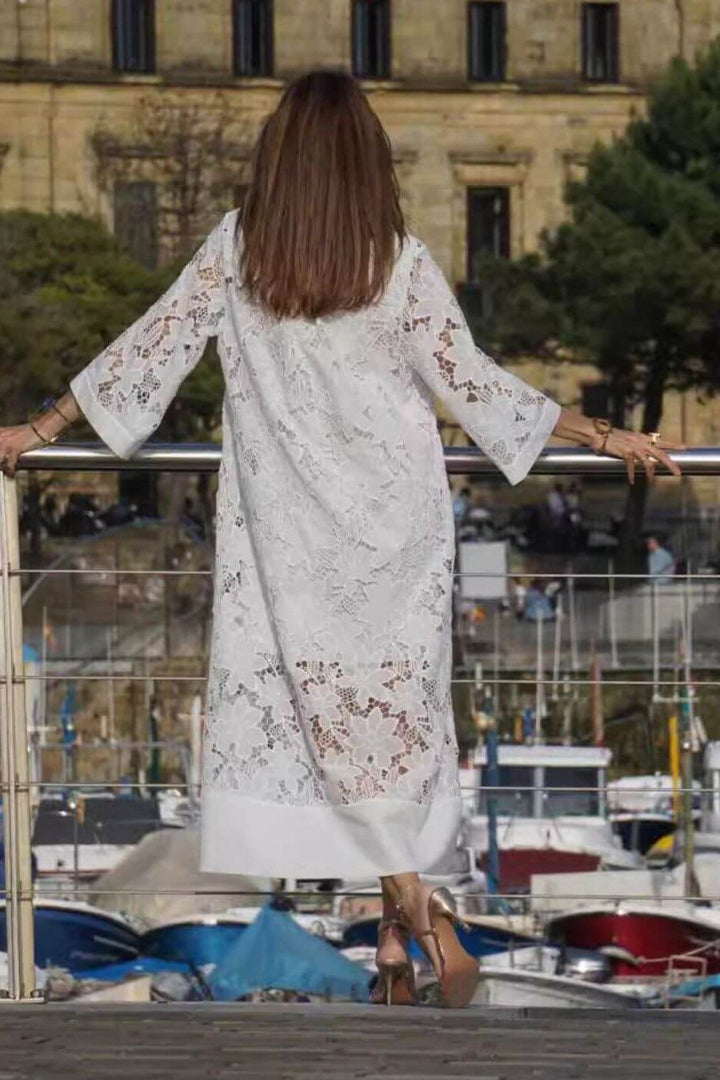 Beautiful women's elegant flowing white maxi dress. Perfect long dress for formal wear or a chic, comfortable event look.