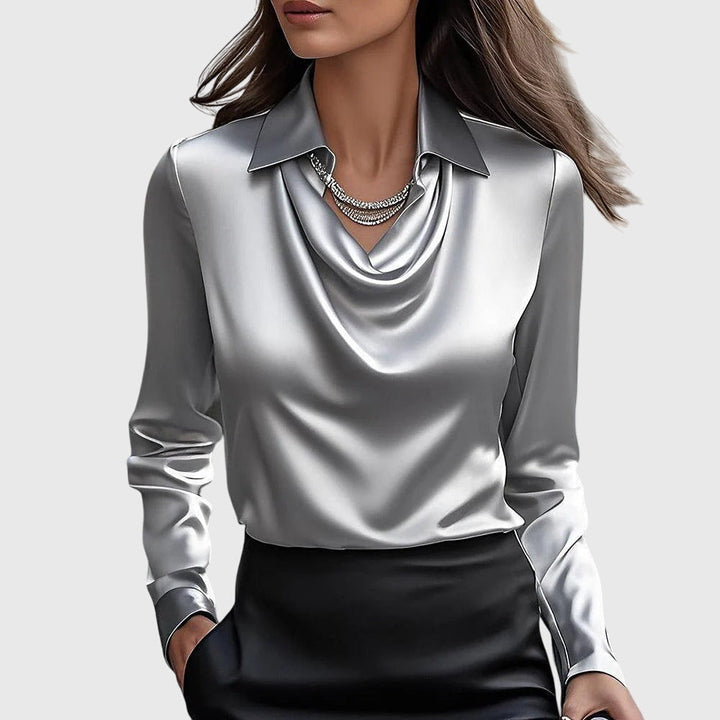 Black elegant flowy blouse for women, featuring a pleated neckline. Ideal for office wear or a chic casual look.