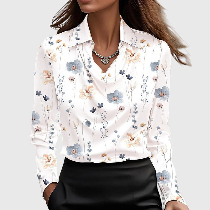 Silver elegant flowy blouse, a sophisticated women's top with a pleated neckline, adding chic style to any outfit.