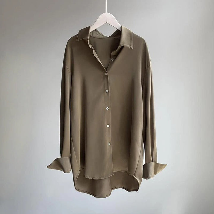 Elegant women's flowy long sleeve blouse in a versatile solid color, perfect for casual chic or workwear.