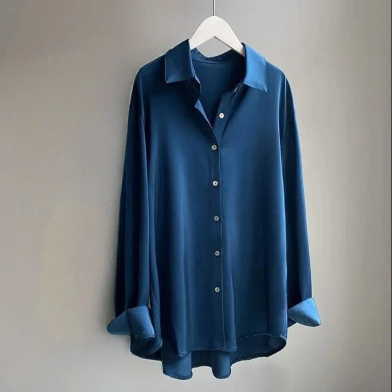 Women's white long sleeve flowy top, ideal for office attire or a casual chic spring fashion look.