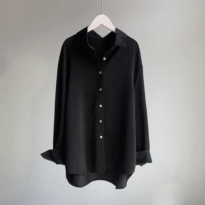 Stylish black flowy blouse for women, a versatile elegant shirt perfect for both work and casual occasions.