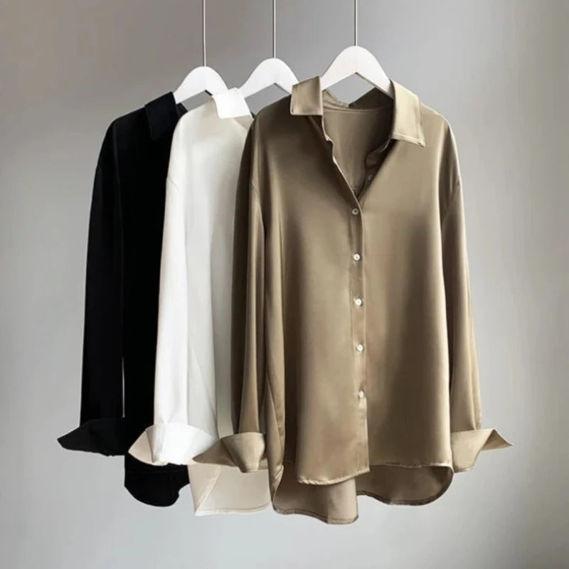 Blue elegant flowy women's blouse, featuring long sleeves for effortless style, great for office or spring wear.