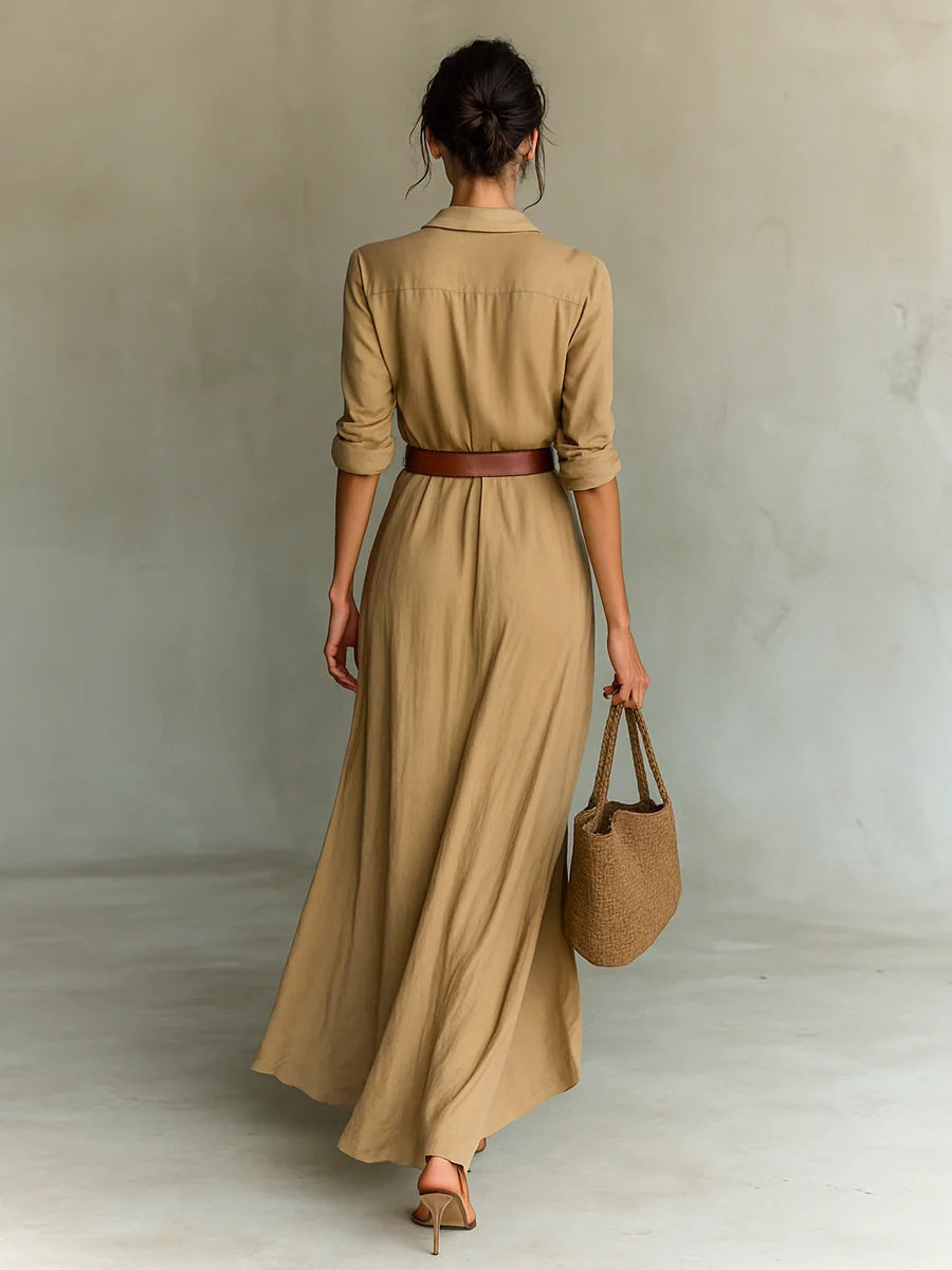 Flowy women's maxi dress in a comfortable fabric, with an elegant belt, ideal for versatile summer and evening wear.