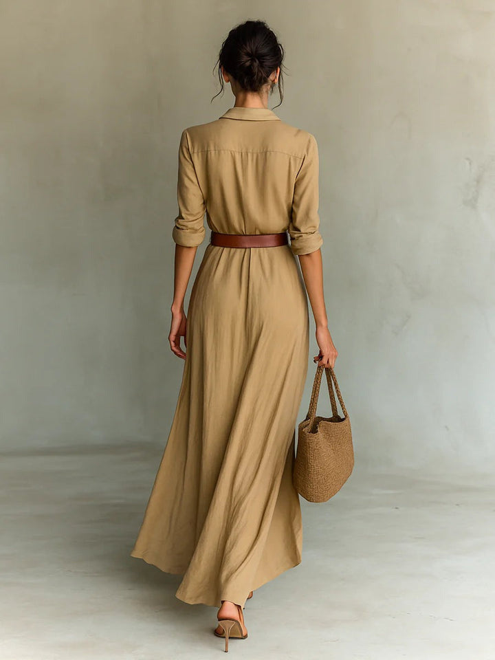Flowy women's maxi dress in a comfortable fabric, with an elegant belt, ideal for versatile summer and evening wear.