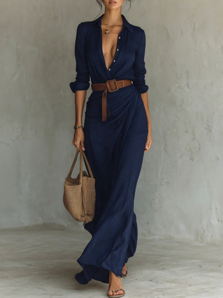 Women's elegant maxi dress featuring a chic v-neck and defining belt, offering a comfortable, flowy summer style.
