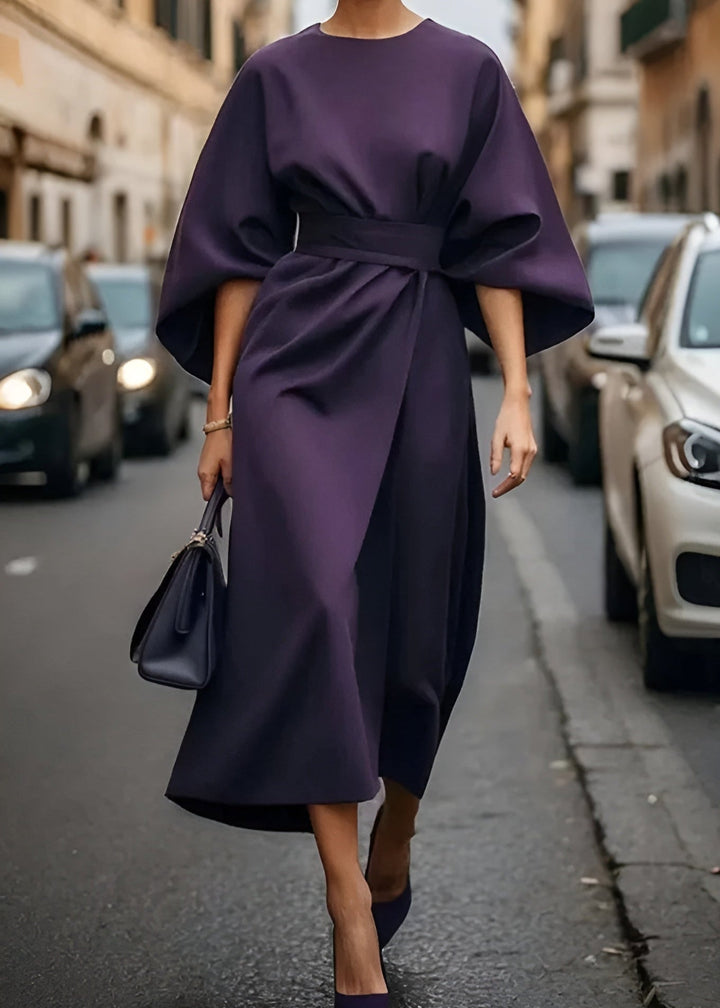 Women's elegant long maxi dress featuring a beautiful flowy design and flattering belted waist. Versatile attire.