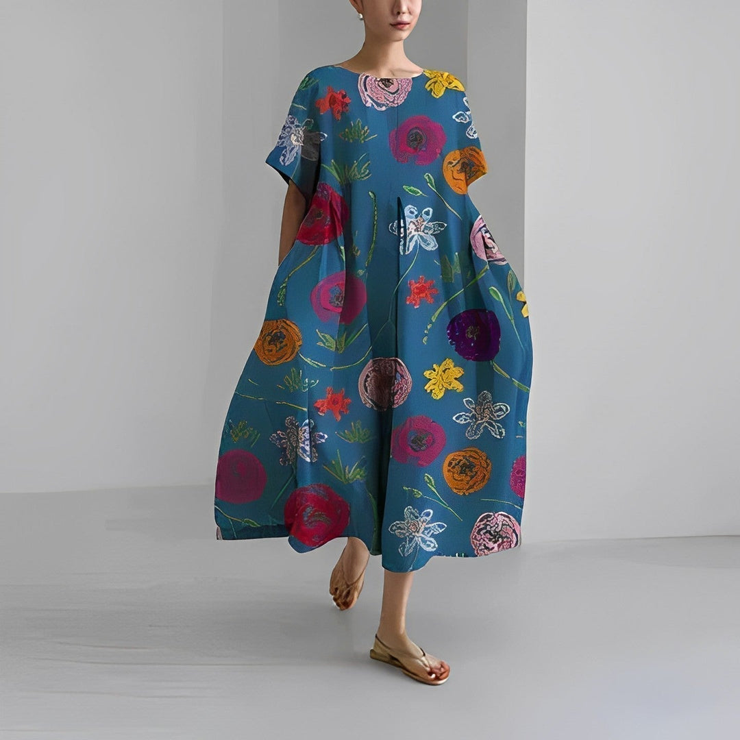 Back view of women's Clara maxi dress, showing elegant flowy silhouette and waist accent