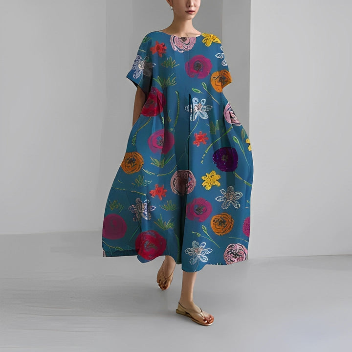 Back view of women's Clara maxi dress, showing elegant flowy silhouette and waist accent