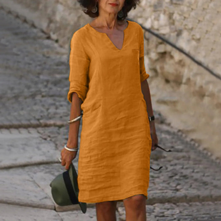Chic women's Isalie midi dress, a breathable and elegant choice for warm weather.