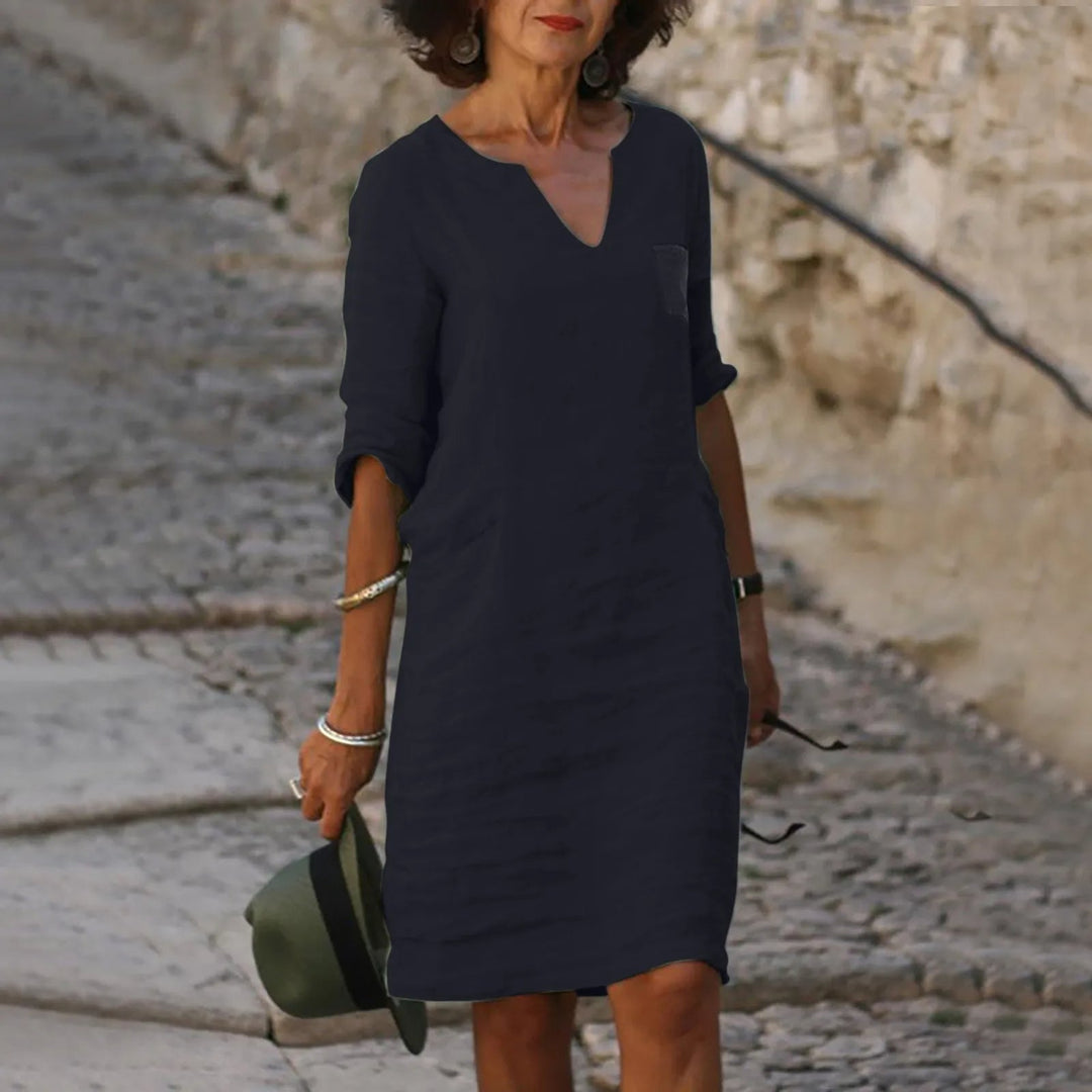 Women's flowy midi dress, an essential breathable and versatile piece for summer.