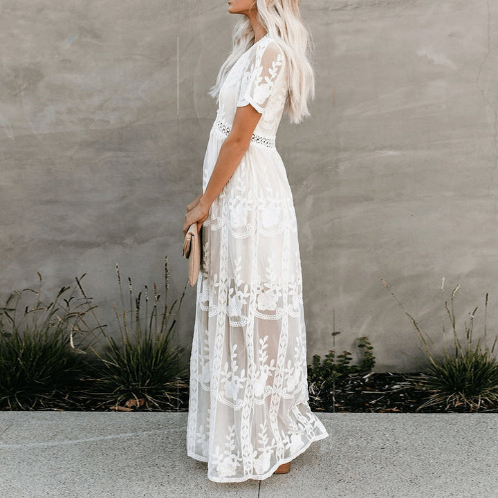 Flowy women's summer dress with v-neck, made from soft viscose fabric, perfect for warm weather.