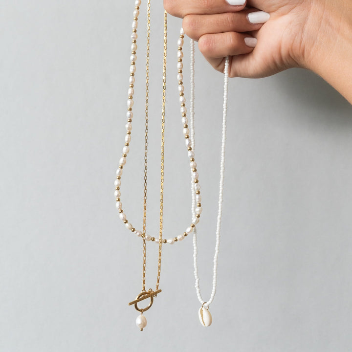 Beautifully strung Freshwater Pearl Necklace (Lucía) showcasing its natural luster and secure gold-plated clasp.