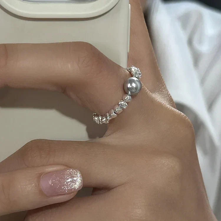 Elegant women's galaxy pearl ring in silver, adjustable for perfect fit. Celestial wrap design, a unique fashion accessory.