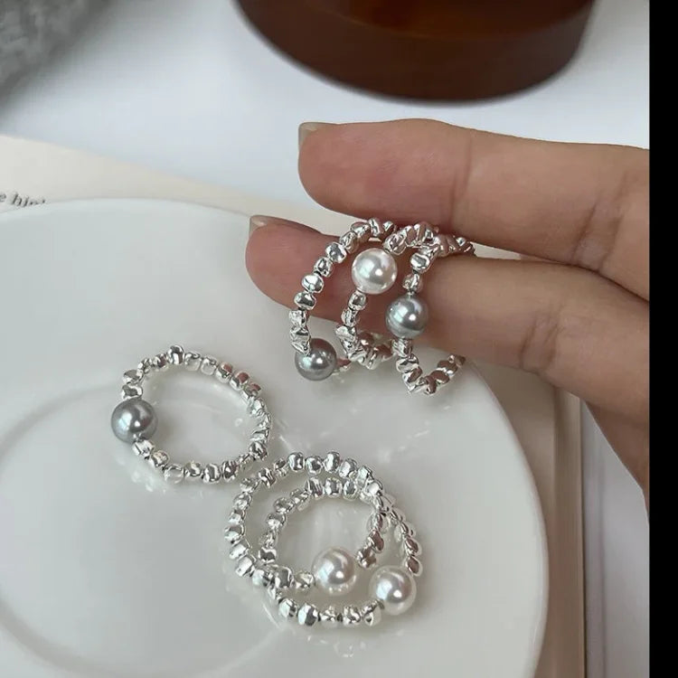 Silver adjustable women's pearl galaxy ring. Elegant celestial jewelry, perfect fashion accessory or gift for her.