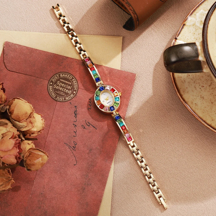 Rose gold women's gemstone bracelet watch, a stunning elegant jewelry timepiece.