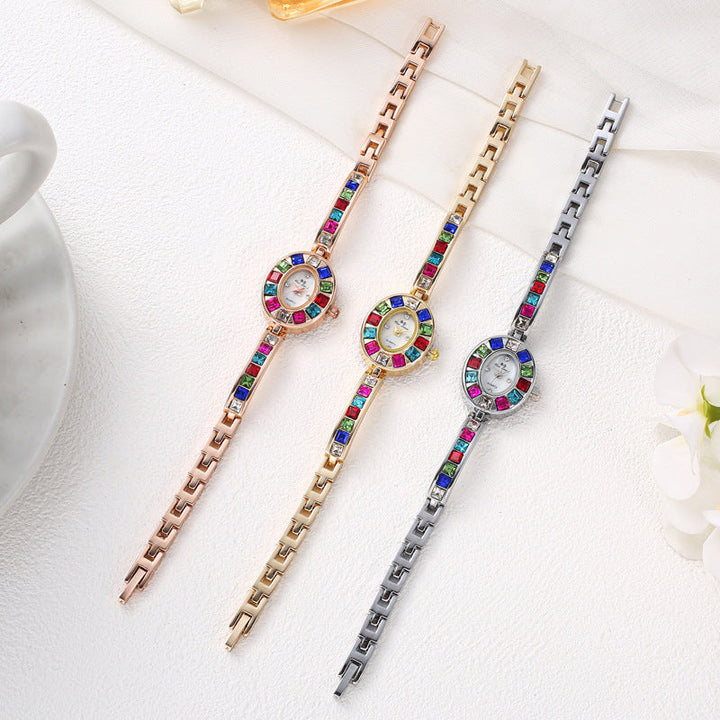 Stylish women's jewelry watch with gemstone accents and a fashionable bracelet strap.