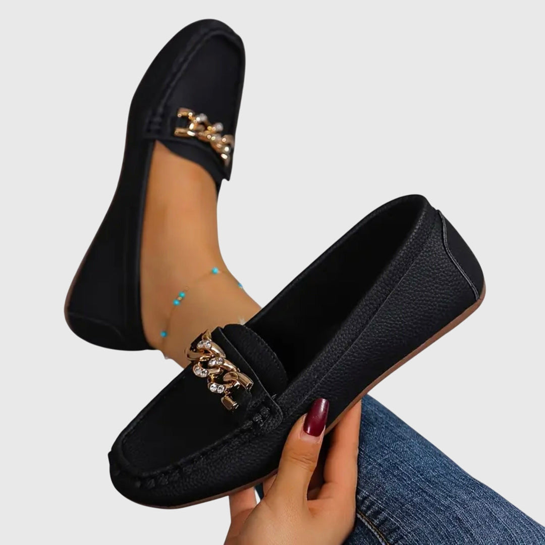 Women's dressy gold-chain wedge loafers, offering elegant style and comfortable wear.