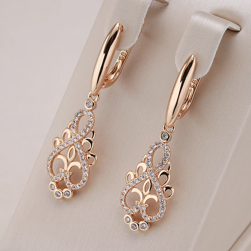 Elegant women's gold earrings with sparkling zirconia stones. Perfect fashion accessory or gift.