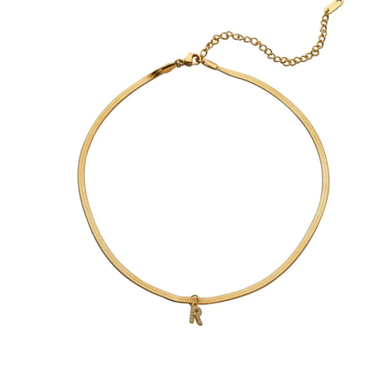 Elegant women's gold initial necklace, a personalized custom jewelry piece and fashion accessory for her.