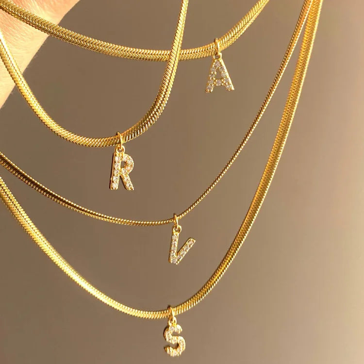 Dainty personalized gold initial necklace for women, an elegant custom jewelry gift for her.