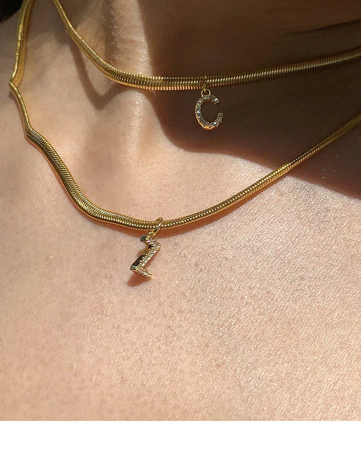 Stylish women's gold initial necklace, perfect custom personalized jewelry and elegant gift for her.
