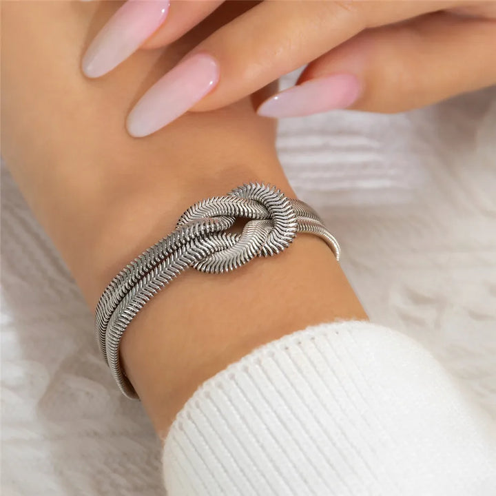 Chic silver knotted snake chain bracelet for women, perfect elegant jewelry.