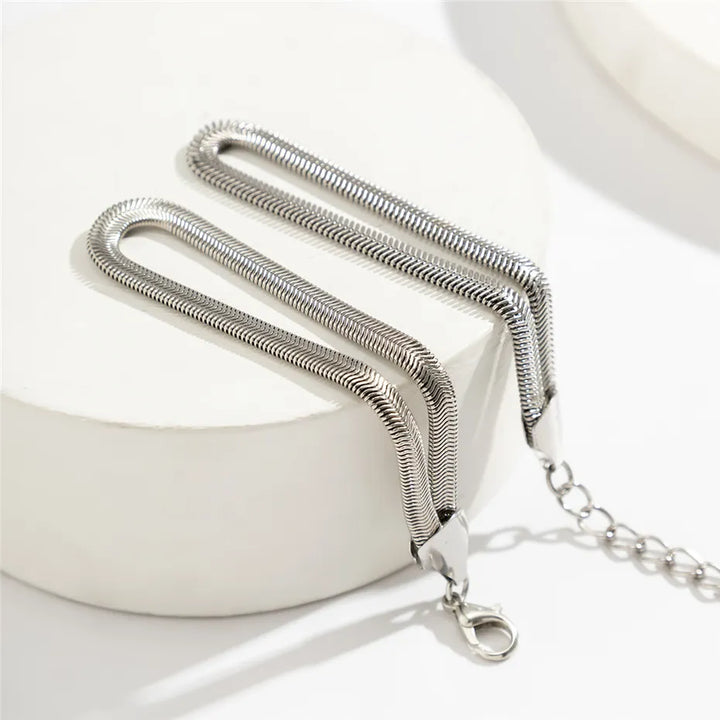 Women's fashion alloy knotted snake chain bracelet, an elegant accessory.