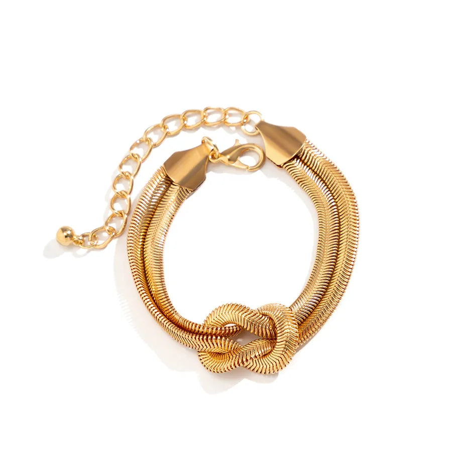 Knotted snake chain bracelet for women, a sleek gold alloy elegant jewelry accessory.