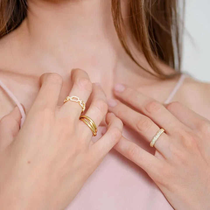 Marina women's gold link ring, intricately designed with brilliant zirconia. A stunning and versatile piece of jewelry.