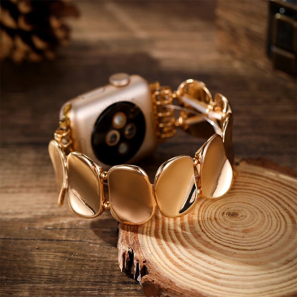 Silver sculpted metal smartwatch band for women, elegant jewelry accessory.