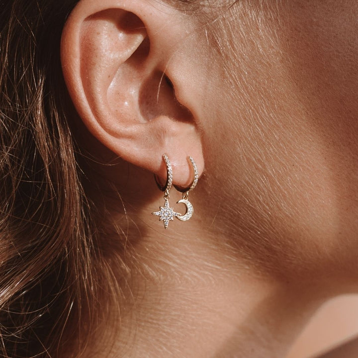 Elegant women's gold moon & star drop earrings with sparkling zirconia, perfect celestial jewelry.