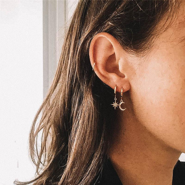 Hypoallergenic silver moon & star drop earrings for women, featuring dazzling zirconia.