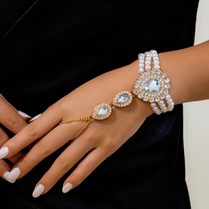 Premium women's gold jewelry set, with real pearls & emeralds, durable stainless steel base, elegant fashion accessory.