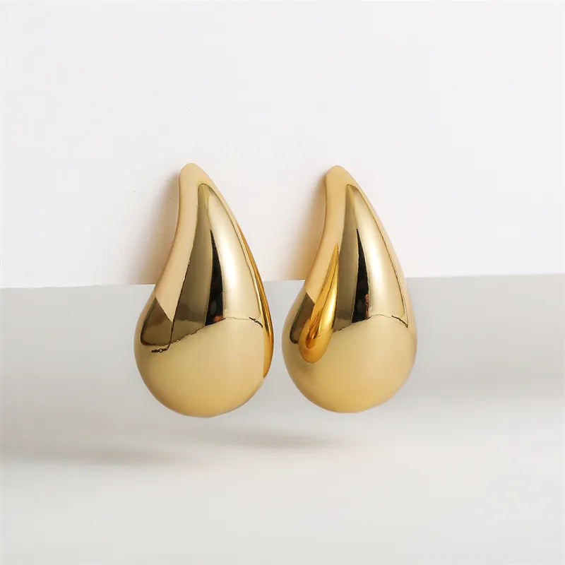 Glamorous gold plated crystal drop earrings for women, ideal for special occasions & evening wear.